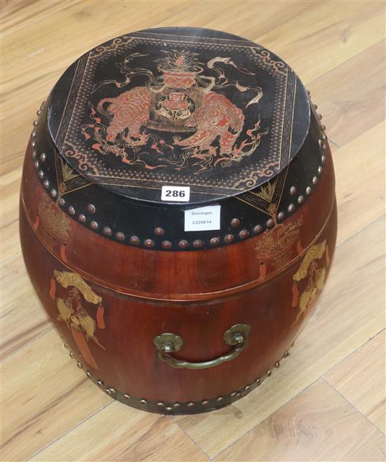 A Chinese red and black lacquer barrel shaped container